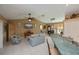 Open floor plan features a combined living room and kitchen with white tiled flooring at 24362 Yacht Club Blvd, Punta Gorda, FL 33955