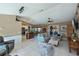Open-concept living space with modern decor, tile floors, and abundant natural light at 24362 Yacht Club Blvd, Punta Gorda, FL 33955