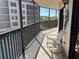 The outdoor screened balcony offers a great view of the building and trees at 25188 Marion Ave # F201, Punta Gorda, FL 33950