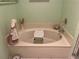 Bathroom features a large tub with seating at 25188 Marion Ave # F201, Punta Gorda, FL 33950