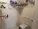 Walk-in closet with multiple levels of wire shelving is ready for organizing all your wardrobe items at 25188 Marion Ave # F201, Punta Gorda, FL 33950