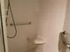 Brightly lit shower with seat and safety bar at 25188 Marion Ave # F201, Punta Gorda, FL 33950
