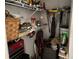 Storage room with cleaning supplies, tools, and other items for home maintenance and organization at 25188 Marion Ave # F201, Punta Gorda, FL 33950