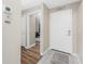 Welcoming entrance featuring a new front door, ceramic tile, wood flooring and a charming 'LOVE' sign at 26397 Nadir Rd # 208, Punta Gorda, FL 33983