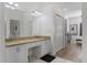 Well-lit Primary bathroom featuring double sinks and ample storage at 2668 Clovelon St, North Port, FL 34291