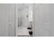 Bathroom with marble tile flooring and white walls and multiple closets at 2668 Clovelon St, North Port, FL 34291