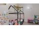 Playful bedroom with a house-frame bed, colorful decorations, and ample space for fun activities at 2668 Clovelon St, North Port, FL 34291