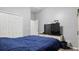 This bedroom has gray walls, wood laminate floors and a large closet at 2668 Clovelon St, North Port, FL 34291