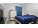 The bedroom features a large window, wood laminate flooring, and a neutral color scheme at 2668 Clovelon St, North Port, FL 34291