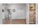 Inviting entryway features neutral walls, decorative niches, and stylish wood-look floors leading to the dining room at 2668 Clovelon St, North Port, FL 34291