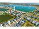 Aerial view of a neighborhood with waterfront property overlooking a scenic lake on a sunny day at 16928 Curry Preserve Dr, Punta Gorda, FL 33982