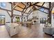 Spacious clubhouse with high ceilings, exposed beams, stone fireplace, and stylish furniture at 16928 Curry Preserve Dr, Punta Gorda, FL 33982