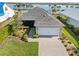 Charming single-Gathering home featuring a two-car garage, paved driveway, and well-maintained landscaping at 16928 Curry Preserve Dr, Punta Gorda, FL 33982