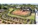 Community playground featuring swings, slides, and a fenced-in play area for children at 16928 Curry Preserve Dr, Punta Gorda, FL 33982