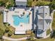 Aerial view of a modern community pool with lounge chairs and well-maintained landscaping at 16928 Curry Preserve Dr, Punta Gorda, FL 33982