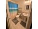 Cozy bathroom featuring a pedestal sink, tiled floors and a shower-tub combination at 18085 Wintergarden Ave, Port Charlotte, FL 33948