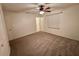 Bedroom with carpeted floors, neutral walls, and natural light for a serene retreat at 18085 Wintergarden Ave, Port Charlotte, FL 33948