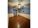 Inviting bedroom with hardwood floors, a ceiling fan, and a cozy atmosphere at 18085 Wintergarden Ave, Port Charlotte, FL 33948