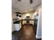 Updated kitchen featuring stainless steel appliances, dark countertops, and tiled backsplash at 18085 Wintergarden Ave, Port Charlotte, FL 33948