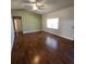 Bright living room with ceiling fan and natural light enhances the open space at 18085 Wintergarden Ave, Port Charlotte, FL 33948