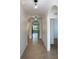 Hallway with tile floor, archways, globe lights and doorway views to other rooms in the home at 3924 Candia Ave, North Port, FL 34286