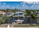 Aerial view of house with dock and boat in canal at 520 Boardman Dr, Punta Gorda, FL 33950