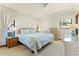 Bright bedroom with wicker furniture, soft lighting, and a cozy atmosphere, creating a peaceful retreat at 520 Boardman Dr, Punta Gorda, FL 33950
