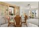 Well-lit dining area with built-in cabinets and seamless transition to the comfortable living space at 520 Boardman Dr, Punta Gorda, FL 33950