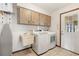 Laundry room with front loading washer and dryer and utility sink at 520 Boardman Dr, Punta Gorda, FL 33950