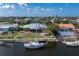 Waterfront property featuring a private dock, canal access, and lush greenery, perfect for boating enthusiasts at 520 Boardman Dr, Punta Gorda, FL 33950