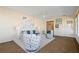 Bright sunroom with seaside decor, comfortable seating, and a door to the outdoor area for relaxation at 520 Boardman Dr, Punta Gorda, FL 33950