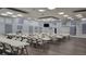 Bright community room featuring tables, chairs, and ample space for activities and events at 6671 Keystone Ct, North Port, FL 34287