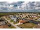 Picturesque waterfront community with tree-lined streets and stunning canal views from above at 126 Peckham Sw St, Port Charlotte, FL 33952