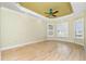 Bright, spacious bedroom with a ceiling fan, light wood floors and multiple windows at 126 Peckham Sw St, Port Charlotte, FL 33952