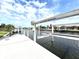View of a well maintained boat lift along the waterfront at 126 Peckham Sw St, Port Charlotte, FL 33952