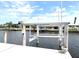 A boat lift sitting along the waterfront at 126 Peckham Sw St, Port Charlotte, FL 33952