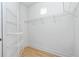 Walk-in closet features wire shelving and hardwood floors at 126 Peckham Sw St, Port Charlotte, FL 33952