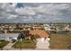Charming waterfront home featuring lush landscaping, a private dock, and an attached two-car garage at 126 Peckham Sw St, Port Charlotte, FL 33952