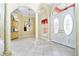 Open foyer with tile flooring, a chandelier, and a decorative front door at 126 Peckham Sw St, Port Charlotte, FL 33952