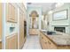 Well-equipped kitchen with modern appliances, custom cabinets, and a breakfast bar at 126 Peckham Sw St, Port Charlotte, FL 33952