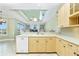 Bright kitchen featuring custom cabinets, stainless dishwasher, and quartz countertops at 126 Peckham Sw St, Port Charlotte, FL 33952
