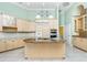 Large kitchen with stone countertops, abundant cabinetry, and stainless steel appliances at 126 Peckham Sw St, Port Charlotte, FL 33952