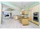 Bright, open-concept kitchen with an eat-in island and stainless appliances at 126 Peckham Sw St, Port Charlotte, FL 33952