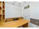 Spacious office featuring wood trim, built-in desk, and ceiling fan at 126 Peckham Sw St, Port Charlotte, FL 33952