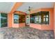 Enclosed outdoor patio with brick flooring and views of the canal at 126 Peckham Sw St, Port Charlotte, FL 33952
