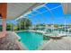 Screened-in pool and spa overlooking a waterfront canal at 126 Peckham Sw St, Port Charlotte, FL 33952