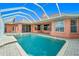An outdoor pool featuring a spa and brick pavers at 126 Peckham Sw St, Port Charlotte, FL 33952