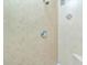 Close up of tiled shower with shower head and accent tile at 126 Peckham Sw St, Port Charlotte, FL 33952
