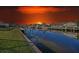 Scenic waterfront homes on a canal, enhanced by a dramatic sunset, create a picturesque setting at 3307 Dominica Ct, Punta Gorda, FL 33950