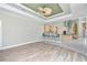 Bright and open living room flows into the kitchen, featuring a breakfast bar with barstool seating at 126 Peckham Sw St, Port Charlotte, FL 33952